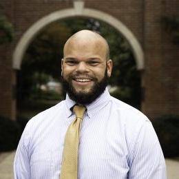 CLAY TAYLOR - man wearing lavender dress shirt with gold tie