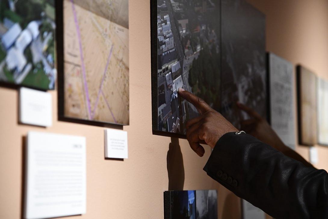 People viewing "We Were Here" exhibit